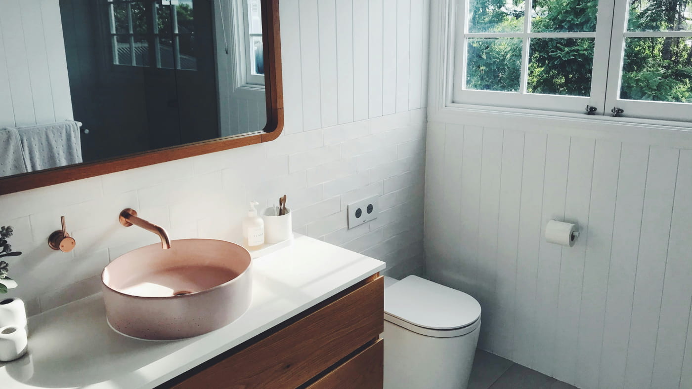 A small and well-designed bathroom with natural light