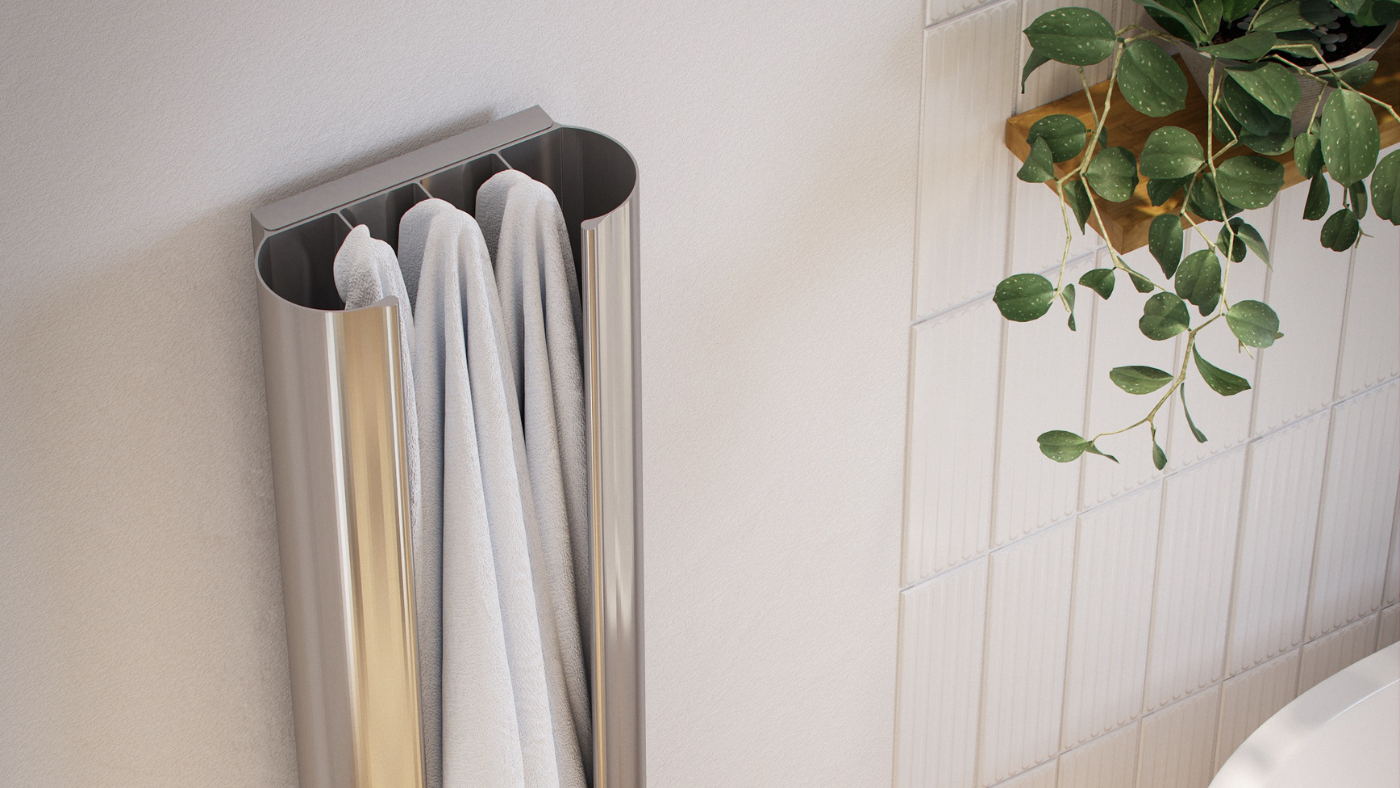 Silver heated towel rail on white wall with neutral aesthetic