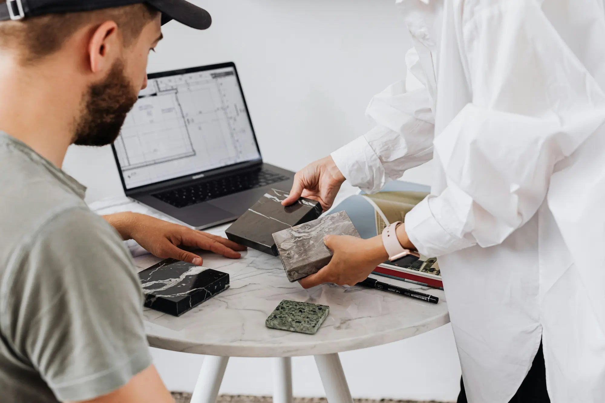 Man selecting tile samples for bathroom